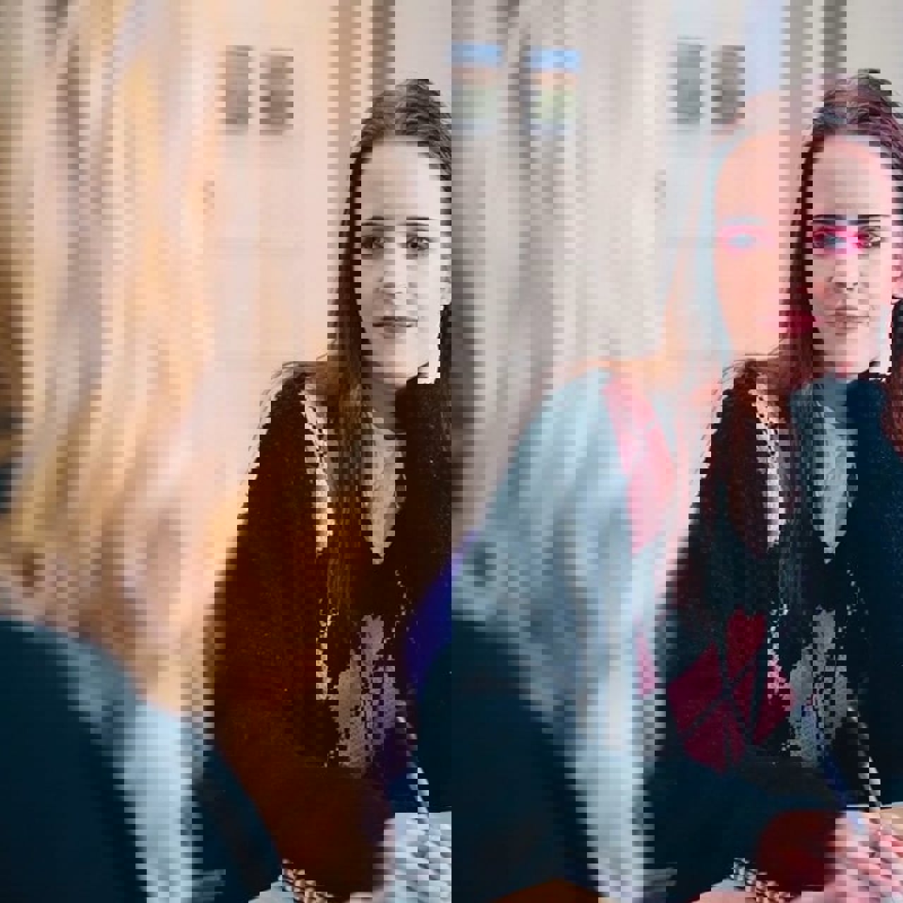 A young woman speaking to an Employment support adviser for career advice