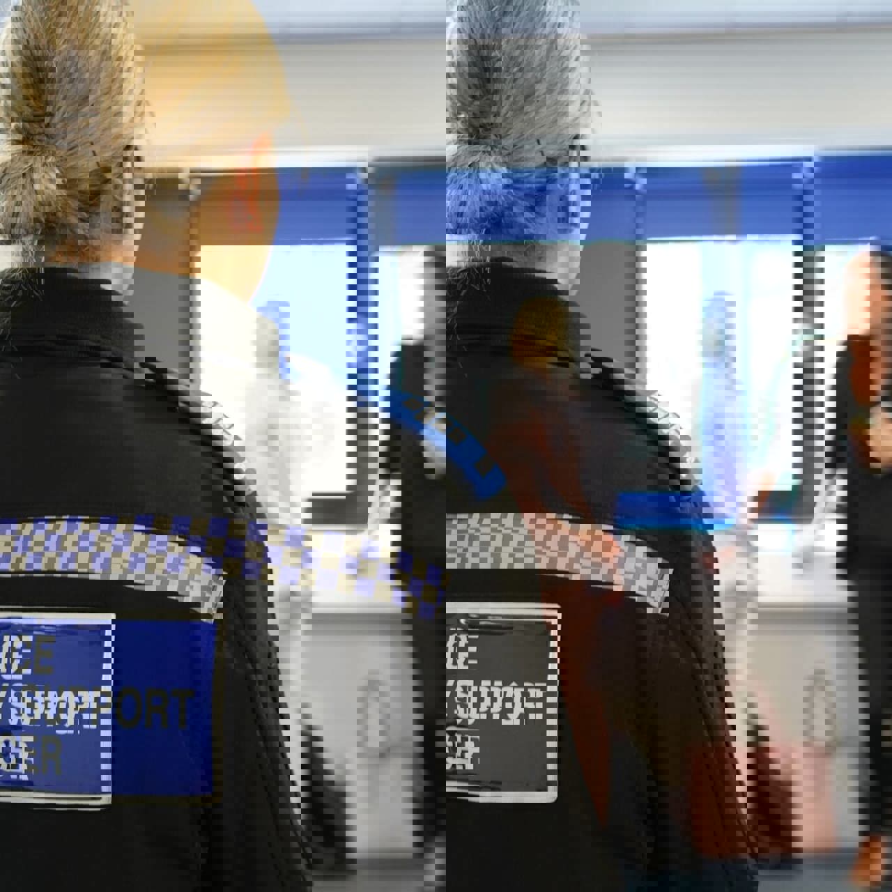 Woman in uniform reading 'Policy Community Support Officer'