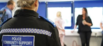 Woman in uniform reading 'Policy Community Support Officer'