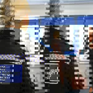 Woman in uniform reading 'Policy Community Support Officer'