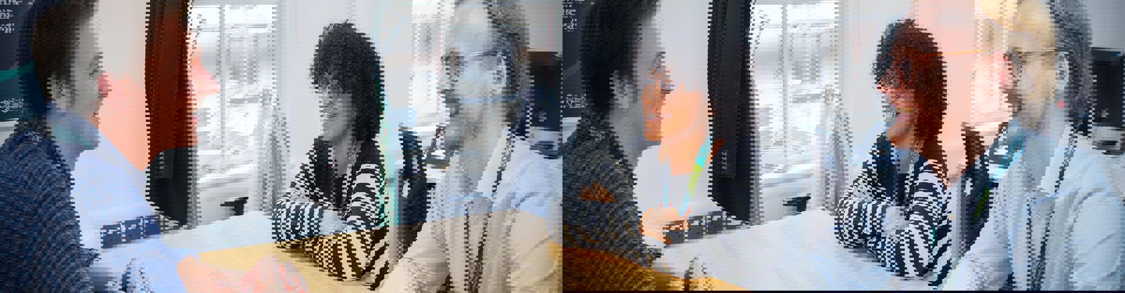 CA Colleagues Talking At Table 2023