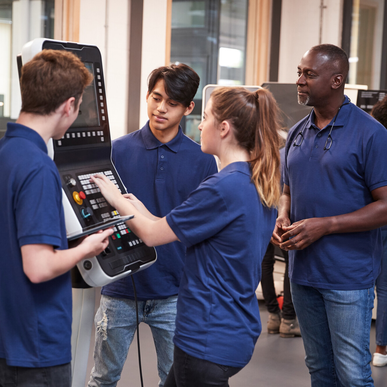Young people working together in a technology room
