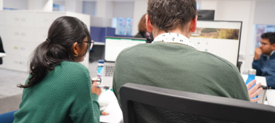 West Yorkshire Combined Authority staff member shows Work experience colleague their screen