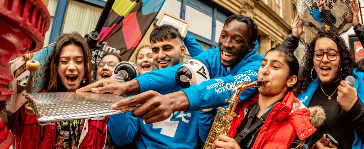 Colleagues at festival procession playing instruments