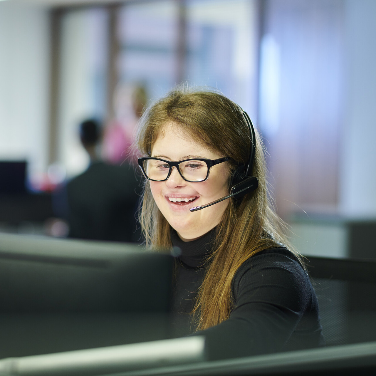 A Young Person Working In An Office