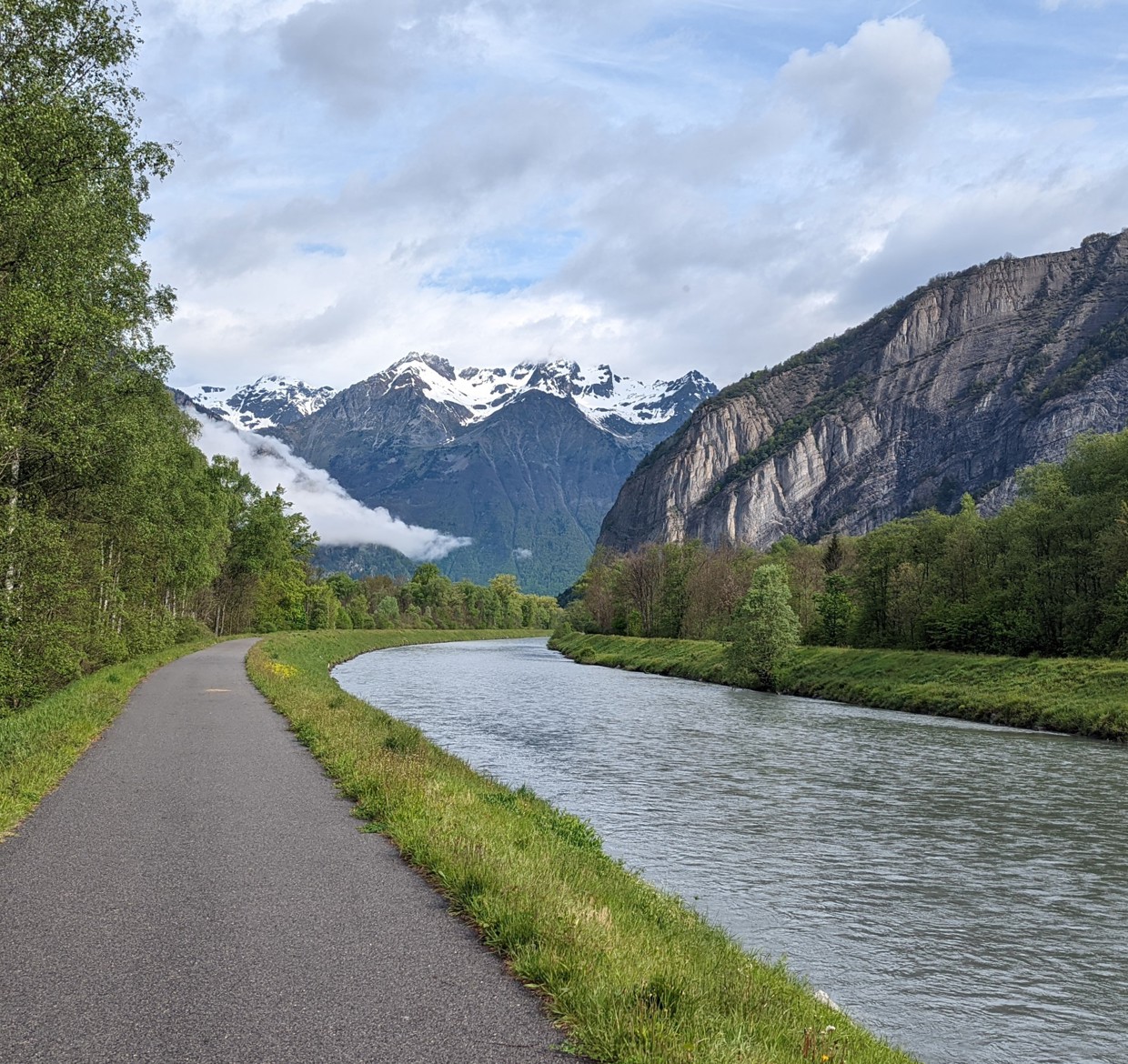 A road alongside a mountain lake
