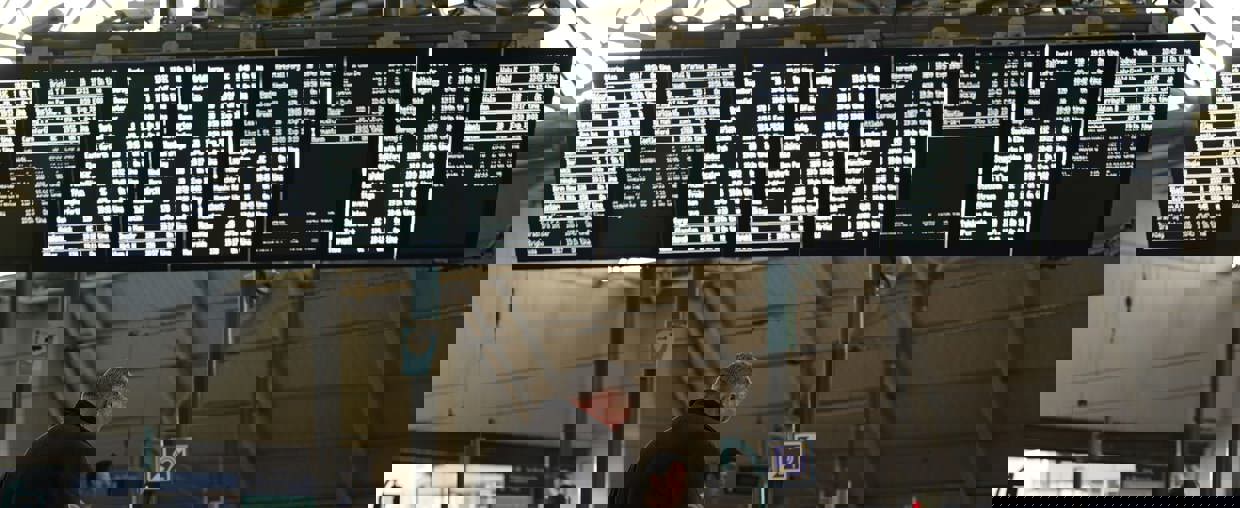 Man Standing In Leeds Train Station