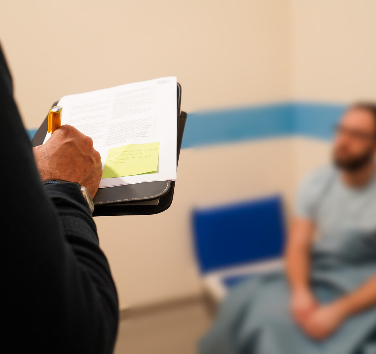 Custody visitor inside a cell with a person under arrest