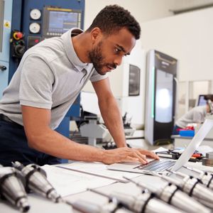 Man working on a laptop in a lab