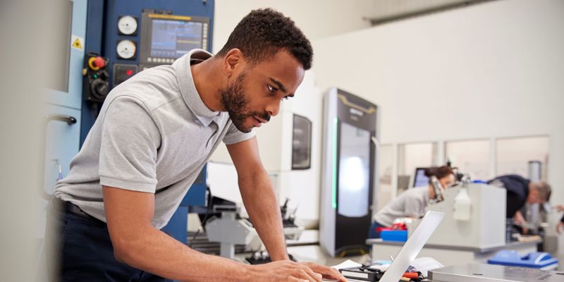 Man working on a laptop in a lab