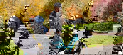 Woman and child with bike in park