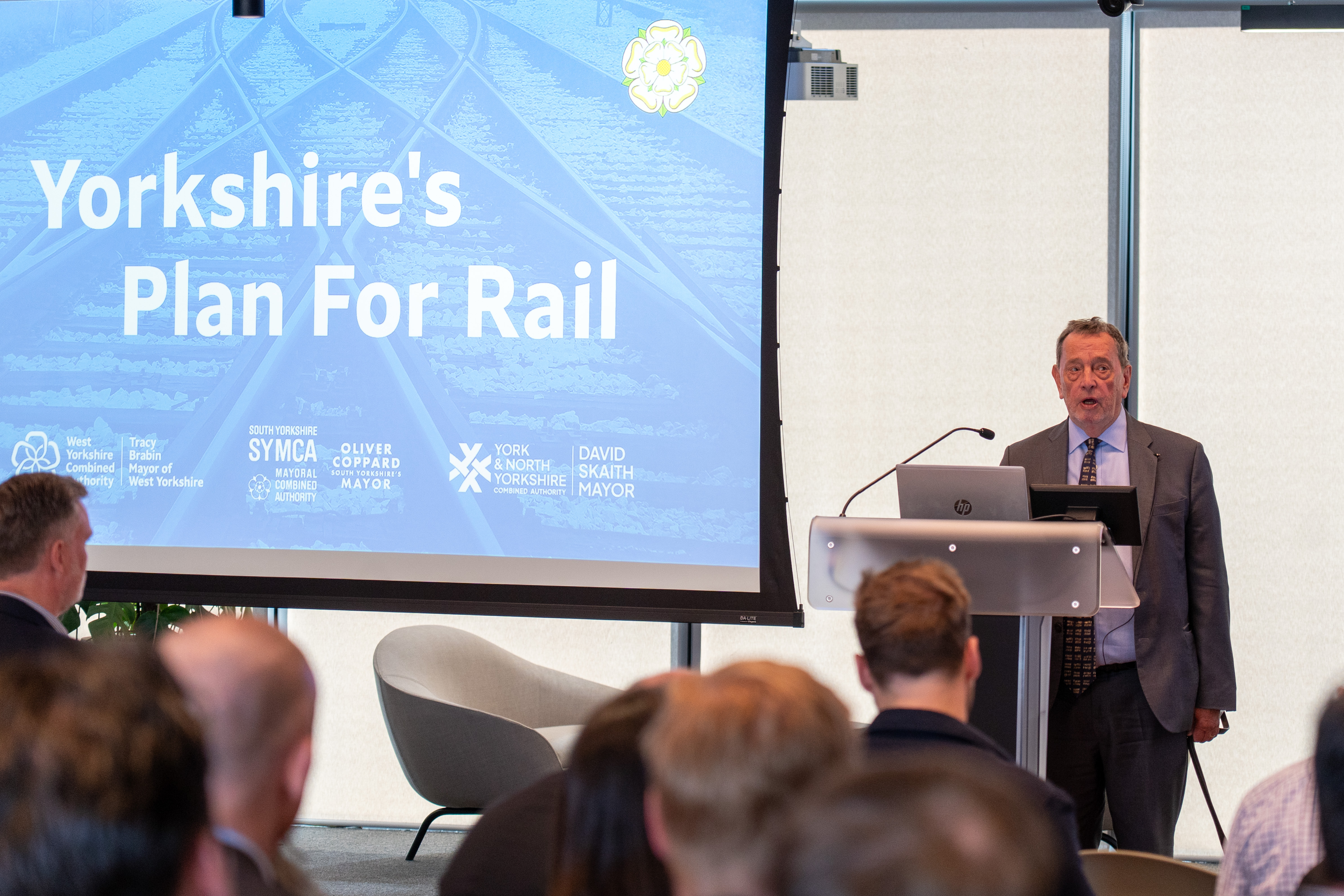 Lord Blunkett speaking at a lectern